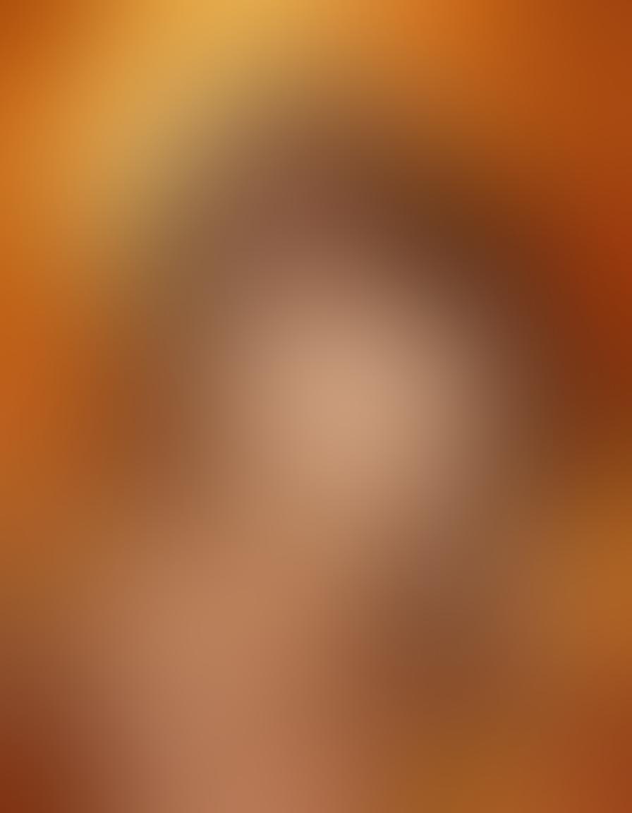 A stylized portrayal of Autumn Riley in a vibrant, cozy autumn setting, surrounded by leaves in shades of orange and gold, as she engages in the art of creating erotic illustrations. Include abstract representations of her unique art style, with flowing lines and playful shapes that signify erotic expression. The background features a warm sunset, adding to the creative atmosphere. Illustrate a blend of traditional and digital art elements to enhance the theme of cultural significance. vibrant colors. digital art.